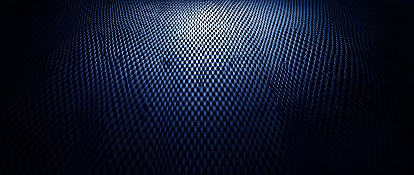 Light highlights a dark blue textured surface with a pattern of repeating oval shapes photo
