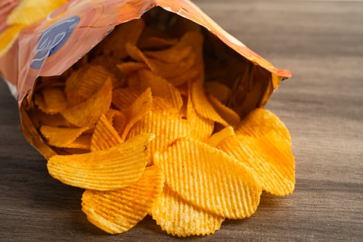 Potato chips delicious BBQ seasoning spicy for crips, thin slice deep fried snack photo