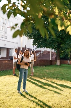 Bonding,, positive emotions. Group, of, students are outside together photo