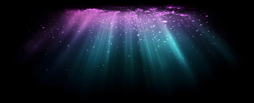 Turquoise rays descend from the violet surface through bright particles in a dark backdrop photo