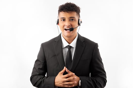 Young handsome call center agent man with beard working using headset over blue background happy face smiling with crossed arms looking at the camera. Positive person. photo