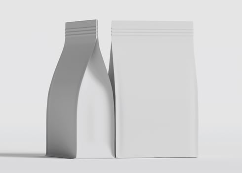 Two identical blank white packaging bags side by side photo
