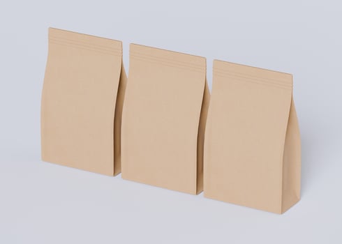 Three paper bags row horizontal light gray background photo