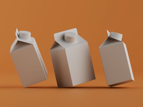 Blank juice or milk cartons mockup in orange background photo