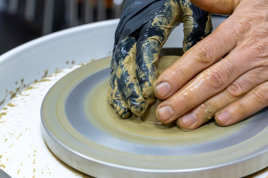 Creative Hands Student Making a Ceramic Bowl in Class photo