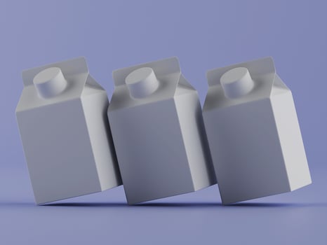 Three modern beverage cartons on lavender background photo