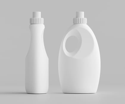 Two white plastic bottles with lids on a gray background photo