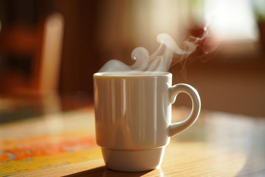 Coffee Background Warm Morning Coffee Steam Rising from Mug on Wooden Table photo