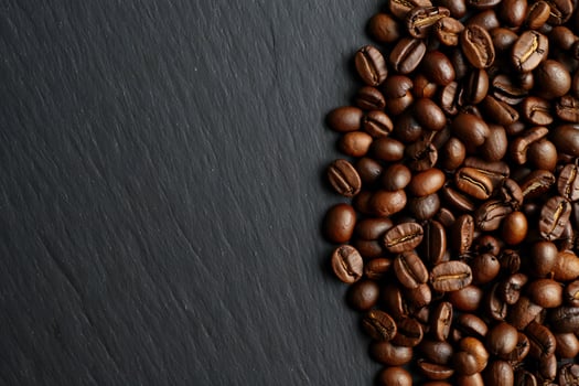 Coffee Background Aromatic Roasted Coffee Beans on Dark Slate Background Rich Texture Coffee Shop Menu Design photo