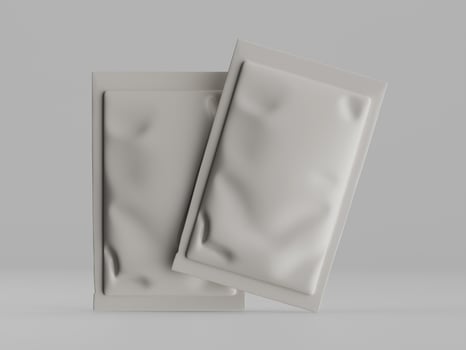 Two packages of white plastic on a gray background photo