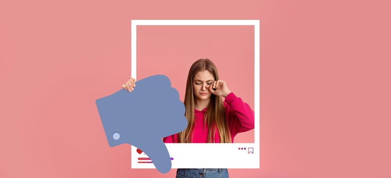 A young influencer expresses mixed feelings about social media. She holds a large thumbs-down symbol, illustrating the complexities of online interactions and influencer culture. photo
