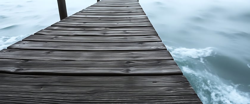 wooden dock extending into the water photo