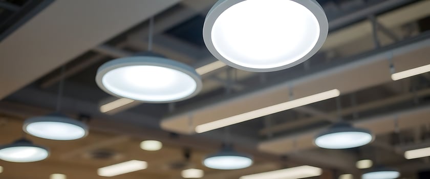 group of round lights hanging from a ceiling photo
