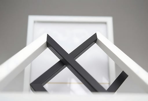 A black and white picture frame with a black and white cross photo