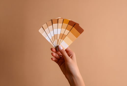 Hand holding a color palette of various shades. photo