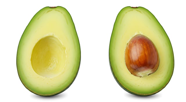 Halved Avocado Showing Seed on White Background for Healthy Eating photo