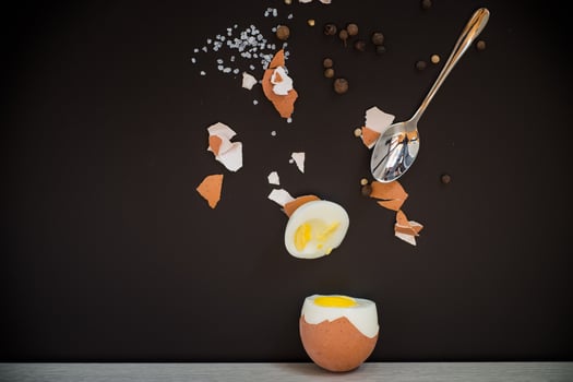 Creative concept of breakfast with egg and salt. photo