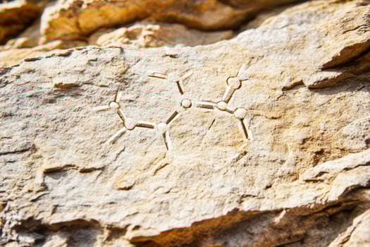 Ancient rock carving of chemical structure photo