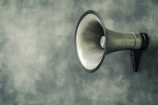 Vintage megaphone mounted on a textured wall photo