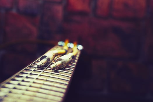 Cord with jacks for connection on fingerboard electric guitar photo