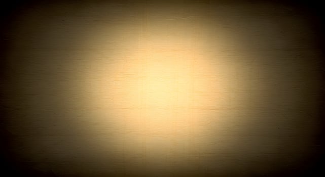 Papyrus texture. Glowing center on weathered paper texture with grunge border, suitable for mystery posters, fantasy game UI, or ancient scripts. photo