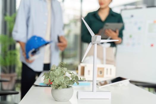 ESG and Sustainability. Professionals discussing renewable energy solutions in a modern office. photo