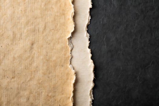 Torn Paper Background Revealing Layers of Texture and Contrast in Colors photo