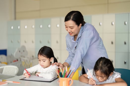 Back to School. Teacher guiding students in a creative learning activity. photo