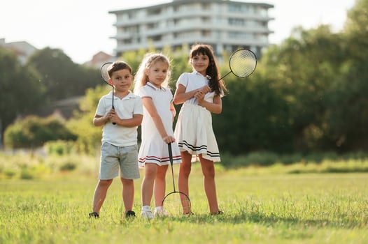 Happy kids are on the summer field. photo