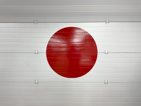 Creative integration of the Japanese flag into garage door design, symbolizing national identity, cultural pride and the influence of Japanese aesthetics in unexpected urban spaces photo
