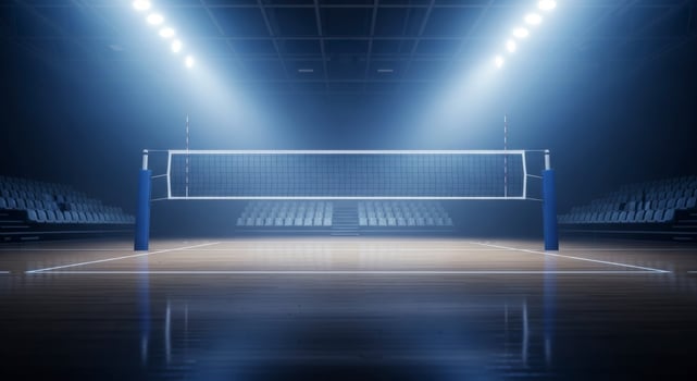 Empty indoor volleyball court with net and stadium lights, ready for a professional game photo