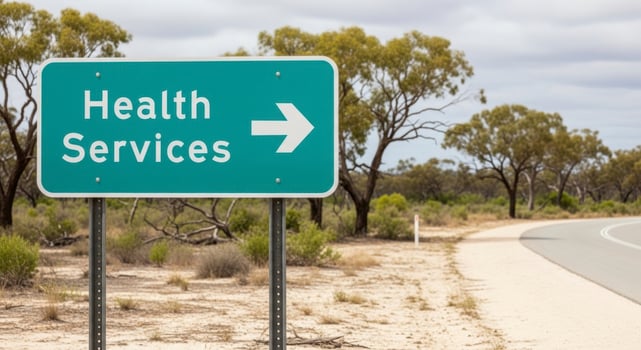 Teal road sign pointing to Health Services on a curving road in a dry landscape. photo