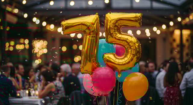 75th Birthday, Birthday or anniversary concept with gold numeral balloons and bright decorations, great for templates, posters, or online greeting visuals. photo