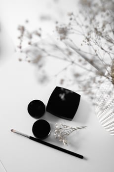 Elegant Minimalist Makeup Flat Lay with Flowers photo