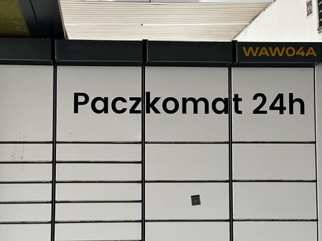 Warsaw, Poland - May 22, 2025 Paczkomat 24h automated parcel locker system in urban setting, showcasing modern delivery solutions with sleek design and functionality photo