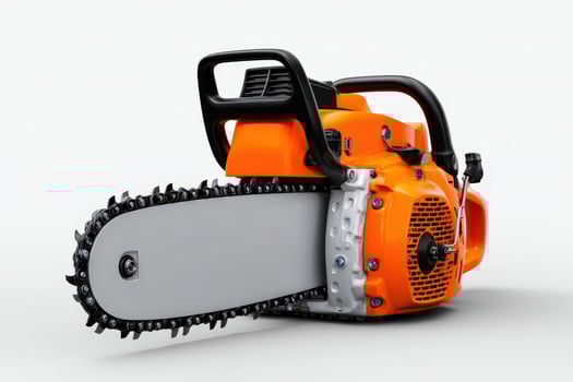 Chainsaw placed on the ground ready for cutting trees and clearing lumber in outdoor settings photo