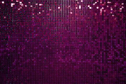 Festive background made of purple shiny small squares with glitter. photo