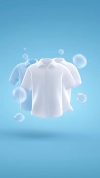 Three floating shirts in various colors, white and light blue, displayed against a soft blue background with bubbles, showcasing a clean and fresh laundry concept photo