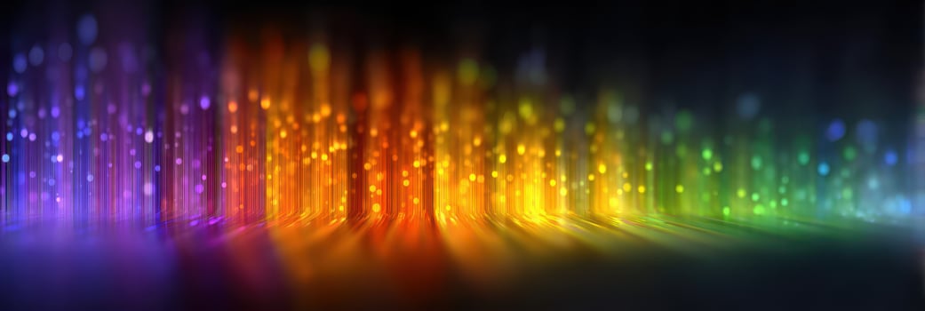 Colorful light display creates a vibrant atmosphere in a dark environment during a nighttime event photo