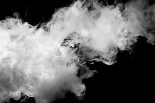 White smoke on a dark back photo