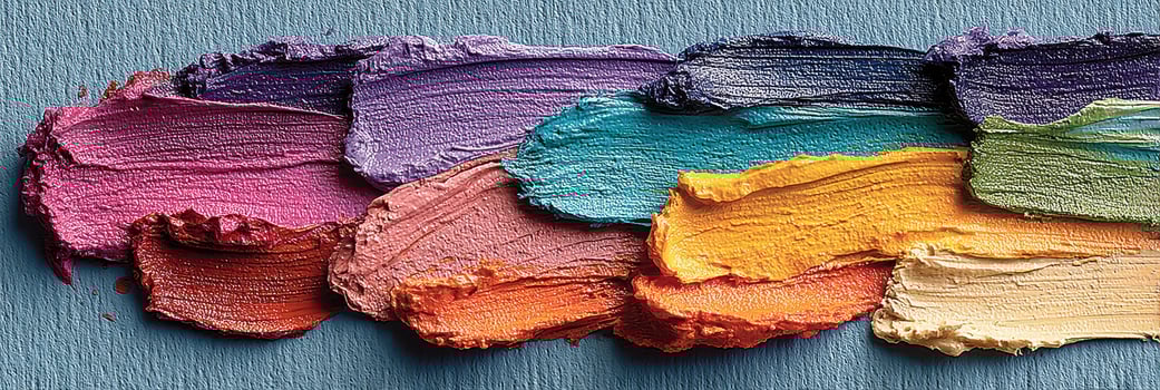 Colorful palette of oil paints displayed on a textured surface during an art creation process photo