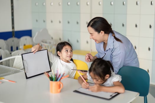 Back to School. Teacher engaging with students in a colorful classroom setting. photo