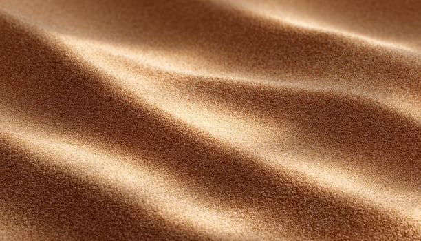 Fine sand texture with sunlight shadows beach close-up warm environment natural concept photo