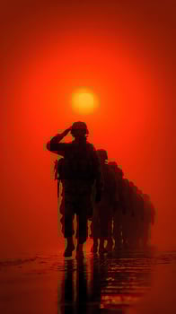 Soldiers saluting during sunset in a dramatic orange landscape near a battlefield photo