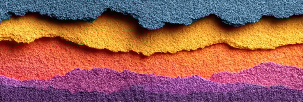 Colorful layers of torn paper create an artistic abstract landscape in vibrant hues photo