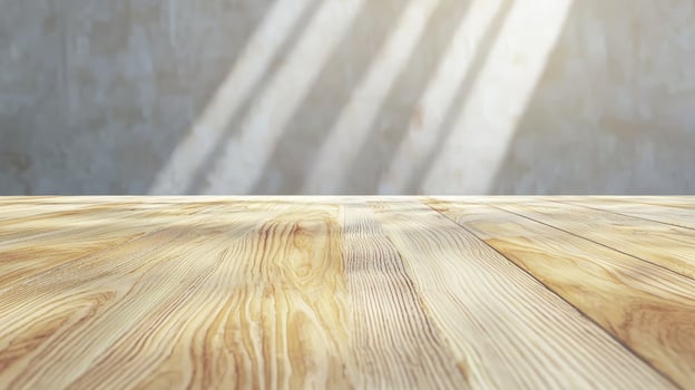 Light streaming onto a light-colored wooden surface. photo