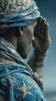 Soldier in dusty uniform salutes with determination in a challenging environment photo