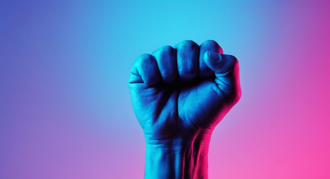 Fist Raised in Protest, Glowing Neon Colors, Represents Strength and Solidarity. photo