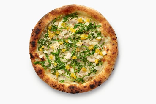 Delicious pizza with chicken, mango, arugula, parmesan and almonds on white background photo
