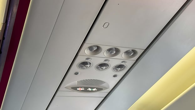 Glimmering aircraft ceiling panels echo futuristic voyages, celebrating Aviation Day and World Tourism Day with metallic serenity photo